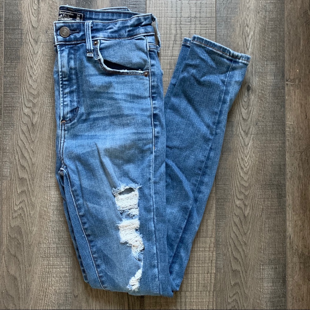 high rise dark blue ripped skinny jeans